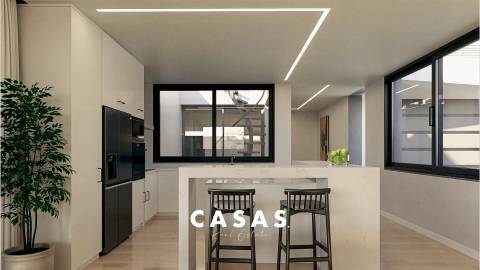Moradia Geminada com 3 Suítes, Piscina privada, ar-condicionado e garagem para 2 viaturas.
