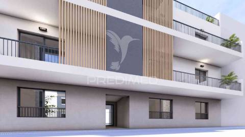 T1 num r/c de um edifício em construção, central - fracção b