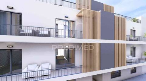 T1 num r/c de um edifício em construção, central - fracção b